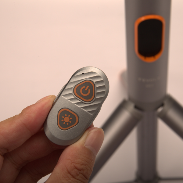 Wireless remote control for adjusting brightness and power on Tripod Adventure Light