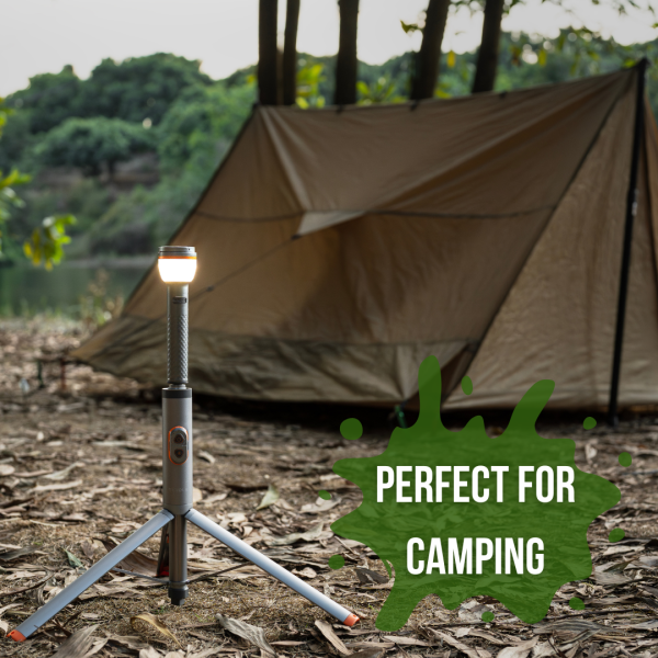 Tripod Adventure Light providing soft illumination outside a tent near the forest