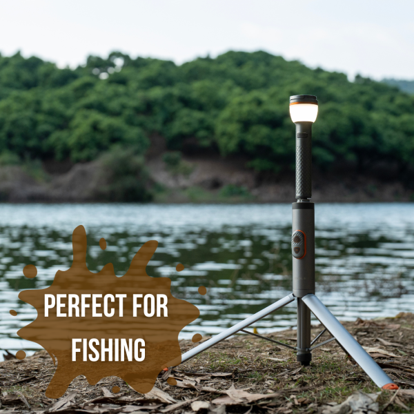 Tripod LED light set up near a lake, perfect for outdoor adventures and fishing trips